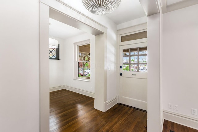 37 W 2nd Ave, Columbus, OH 43201 - foyer entrance with dark wood-style flooring, a chandelier, and baseboards
