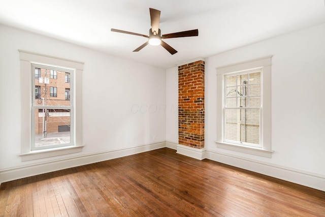 37 W 2nd Ave, Columbus, OH 43201 - unfurnished room with hardwood / wood-style floors, plenty of natural light, and baseboards