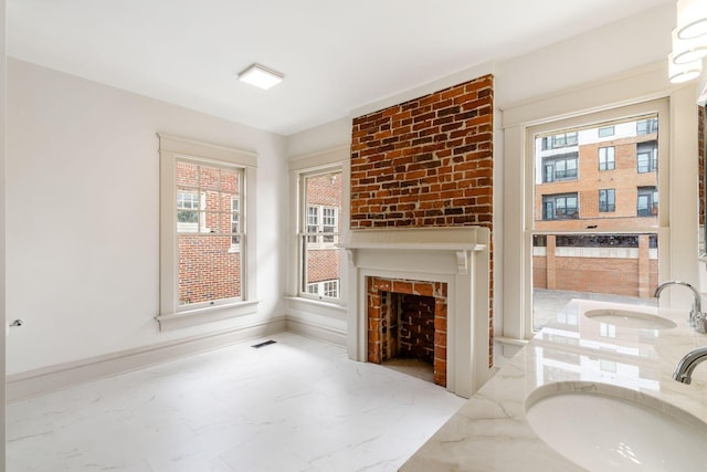 37 W 2nd Ave, Columbus, OH 43201 - living room featuring marble look tile flooring, healthy amount of natural light, and baseboards