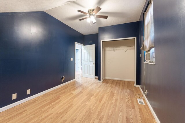5103 Johnstown Alexandria Rd, Johnstown, OH 43031 - unfurnished bedroom with wood finished floors, baseboards, a closet, vaulted ceiling, and a ceiling fan