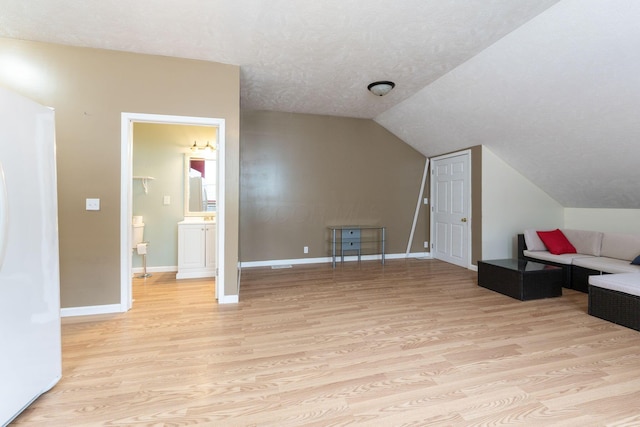 5103 Johnstown Alexandria Rd, Johnstown, OH 43031 - bonus room with light wood-type flooring, baseboards, vaulted ceiling, and a textured ceiling