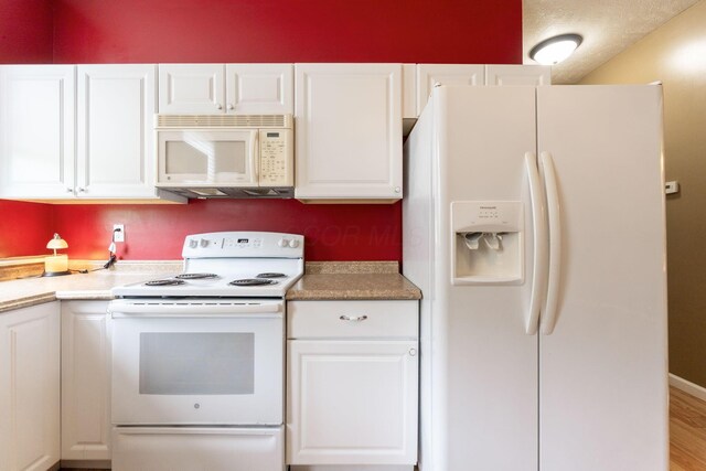 5103 Johnstown Alexandria Rd, Johnstown, OH 43031 - kitchen featuring white appliances, white cabinets, light countertops, and wood finished floors
