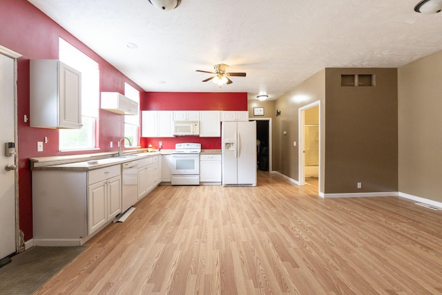 5103 Johnstown Alexandria Rd, Johnstown, OH 43031 - kitchen with white appliances, light wood-style floors, ceiling fan, white cabinetry, and baseboards