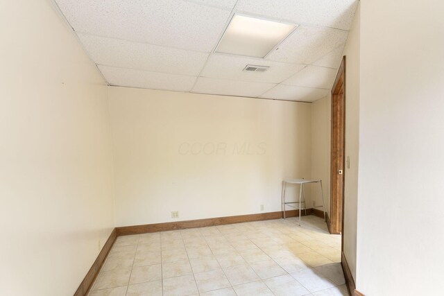 5103 Johnstown Alexandria Rd, Johnstown, OH 43031 - empty room featuring a drop ceiling, baseboards, and light tile patterned floors