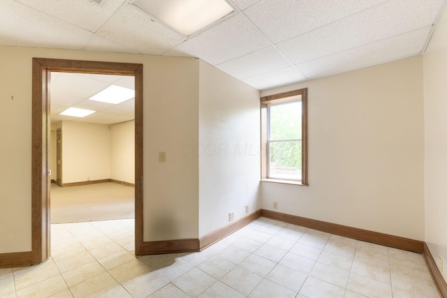 5103 Johnstown Alexandria Rd, Johnstown, OH 43031 - spare room with a paneled ceiling, baseboards, and light tile patterned flooring