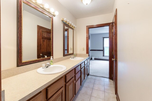 5103 Johnstown Alexandria Rd, Johnstown, OH 43031 - bathroom with double vanity, tile patterned flooring, and baseboards