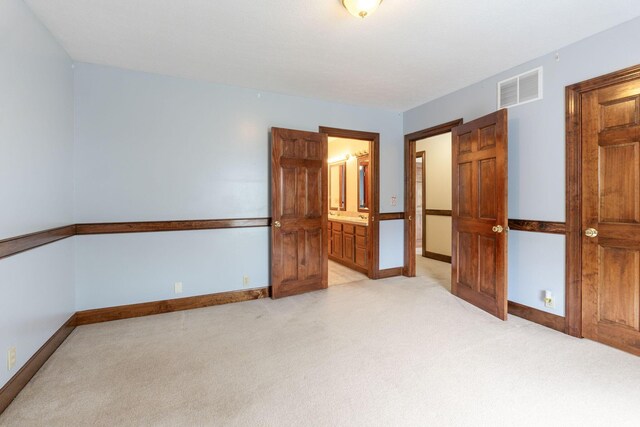 5103 Johnstown Alexandria Rd, Johnstown, OH 43031 - unfurnished bedroom featuring light colored carpet, baseboards, and ensuite bath