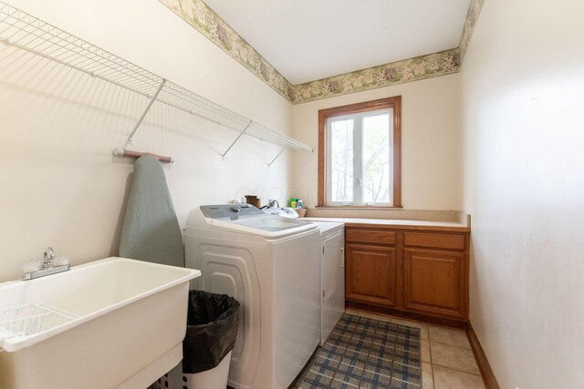 5103 Johnstown Alexandria Rd, Johnstown, OH 43031 - washroom featuring washer and dryer, cabinet space, light tile patterned flooring, and baseboards