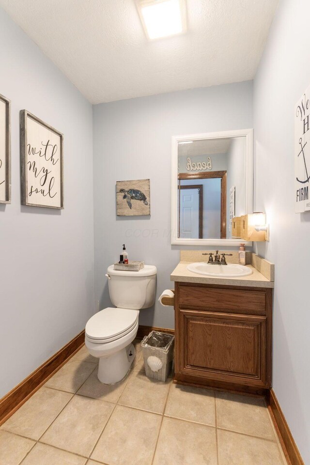 5103 Johnstown Alexandria Rd, Johnstown, OH 43031 - bathroom featuring vanity, toilet, tile patterned flooring, and baseboards