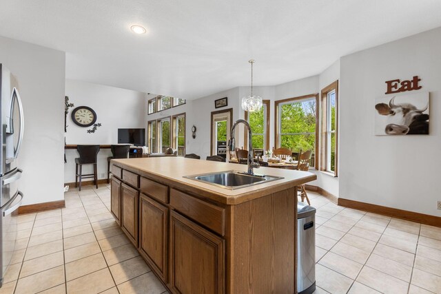 5103 Johnstown Alexandria Rd, Johnstown, OH 43031 - kitchen with a sink, light tile patterned floors, healthy amount of natural light, a center island with sink, and recessed lighting