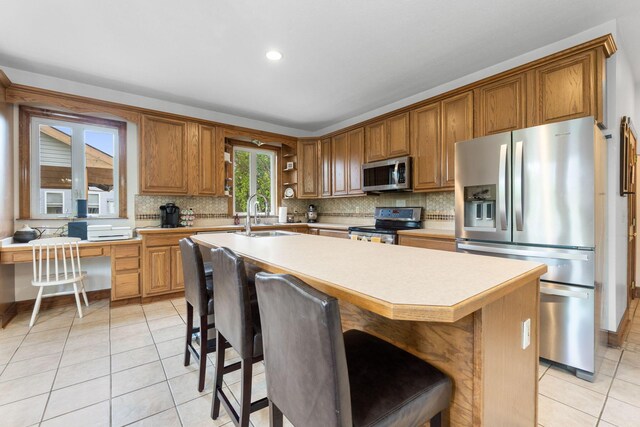 5103 Johnstown Alexandria Rd, Johnstown, OH 43031 - kitchen with stainless steel appliances, a sink, light tile patterned flooring, tasteful backsplash, and recessed lighting