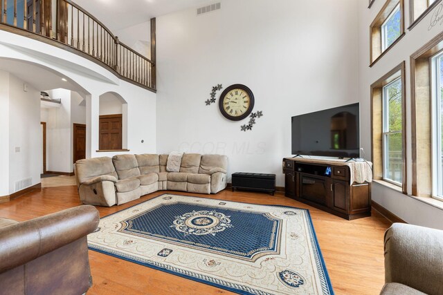 5103 Johnstown Alexandria Rd, Johnstown, OH 43031 - living area with a towering ceiling, light wood-style floors, and baseboards