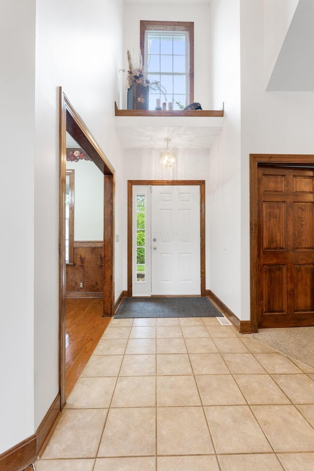 5103 Johnstown Alexandria Rd, Johnstown, OH 43031 - foyer with a high ceiling, a chandelier, baseboards, and light tile patterned floors