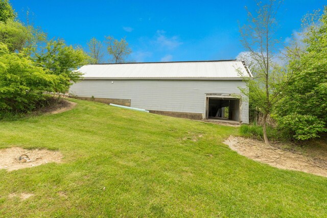 5103 Johnstown Alexandria Rd, Johnstown, OH 43031 - view of side of property featuring a lawn, metal roof, and an outbuilding