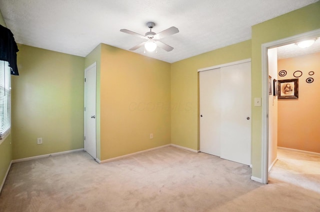 2517 Slateshire Dr, Dublin, OH 43016 - unfurnished bedroom featuring light colored carpet, a closet, baseboards, and ceiling fan