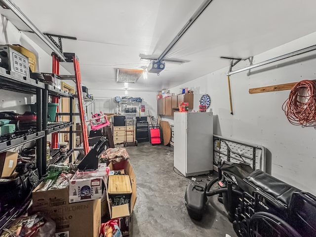 435 Alison Ct, Lancaster, OH 43130 - garage featuring a garage door opener and freestanding refrigerator