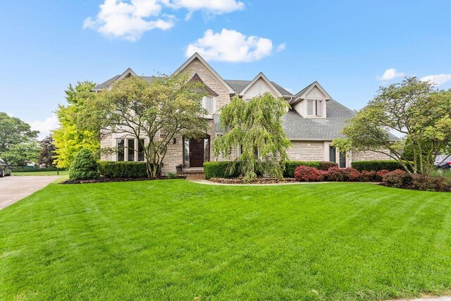 4606 Gershwin Ct, Grove City, OH 43123 - view of front facade featuring stone siding and a front yard