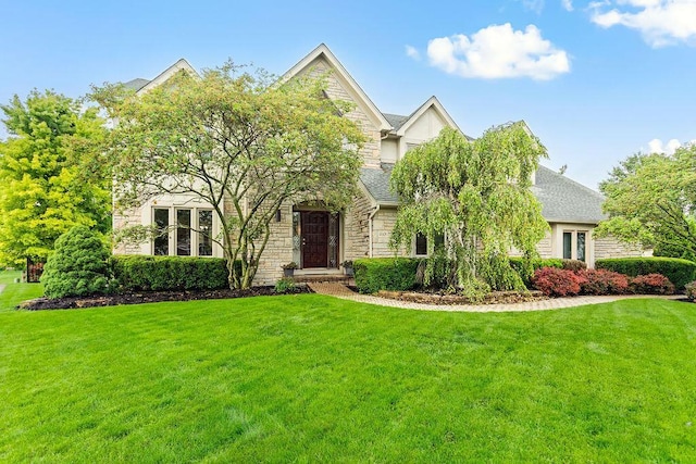 4606 Gershwin Ct, Grove City, OH 43123 - obstructed view of property featuring stone siding and a front lawn