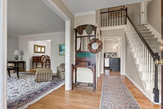 4606 Gershwin Ct, Grove City, OH 43123 - entryway with stairway, light wood-style floors, crown molding, and baseboards