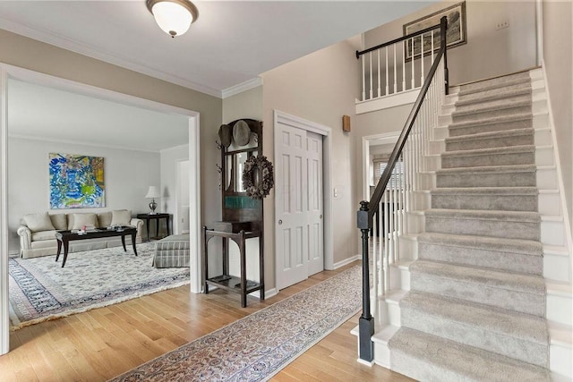 4606 Gershwin Ct, Grove City, OH 43123 - entrance foyer with stairway, crown molding, wood finished floors, and baseboards