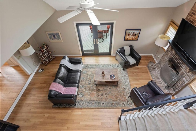 4606 Gershwin Ct, Grove City, OH 43123 - living room featuring wood finished floors, a ceiling fan, vaulted ceiling, baseboards, and french doors