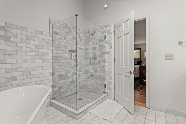 4606 Gershwin Ct, Grove City, OH 43123 - ensuite bathroom with a freestanding tub, a stall shower, and baseboards
