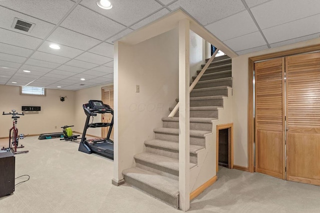 4606 Gershwin Ct, Grove City, OH 43123 - exercise area with light carpet, a paneled ceiling, recessed lighting, and baseboards