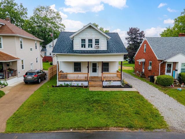 236 Ruth Ave, Mansfield, OH 44907 - bungalow featuring gravel driveway, a porch, a front lawn, and roof with shingles