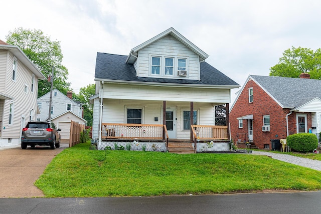 236 Ruth Ave, Mansfield, OH 44907 - bungalow-style home featuring a porch, a front yard, cooling unit, and roof with shingles