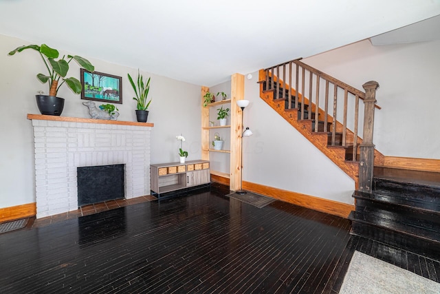 236 Ruth Ave, Mansfield, OH 44907 - stairway featuring hardwood / wood-style flooring, a fireplace, and baseboards