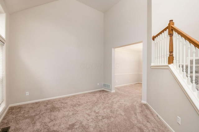 7985 Eric Ct, Lewis Center, OH 43035 - carpeted empty room with vaulted ceiling and baseboards