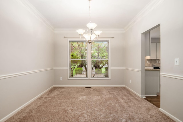 7985 Eric Ct, Lewis Center, OH 43035 - spare room featuring carpet, a chandelier, crown molding, and baseboards