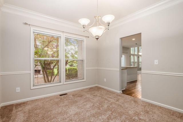 7985 Eric Ct, Lewis Center, OH 43035 - empty room featuring ornamental molding, carpet floors, healthy amount of natural light, a chandelier, and baseboards