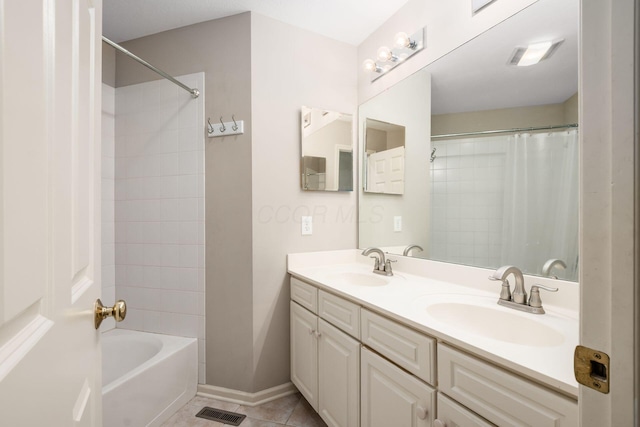 7985 Eric Ct, Lewis Center, OH 43035 - full bath with double vanity, shower / tub combo with curtain, tile patterned flooring, and baseboards