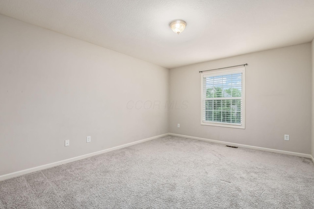 7985 Eric Ct, Lewis Center, OH 43035 - carpeted empty room featuring baseboards