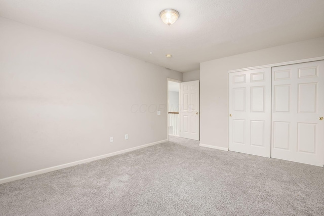 7985 Eric Ct, Lewis Center, OH 43035 - unfurnished bedroom with carpet flooring, baseboards, and a closet