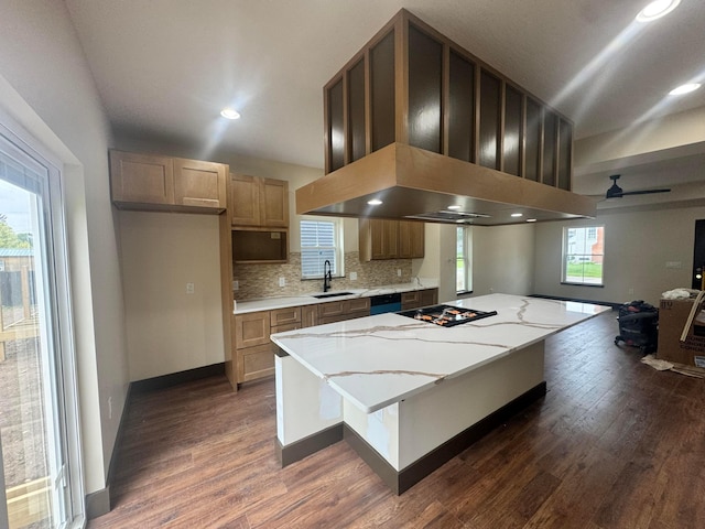 1624 Marlboro Ave, Obetz, OH 43207 - kitchen featuring dark wood-style floors, a kitchen island, tasteful backsplash, black cooktop, and dishwashing machine