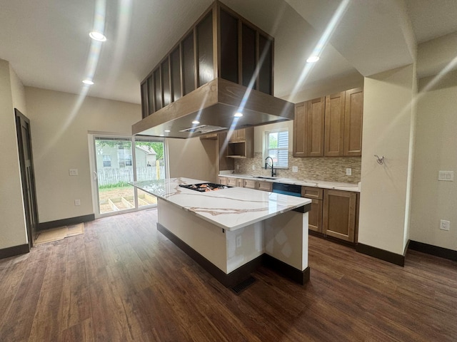 1624 Marlboro Ave, Obetz, OH 43207 - kitchen with dark wood finished floors, backsplash, plenty of natural light, and a kitchen island