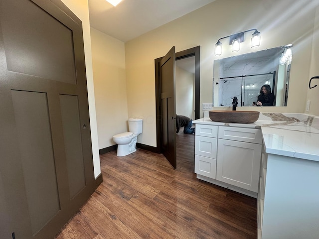 1624 Marlboro Ave, Obetz, OH 43207 - full bath featuring wood finished floors, a shower stall, and vanity
