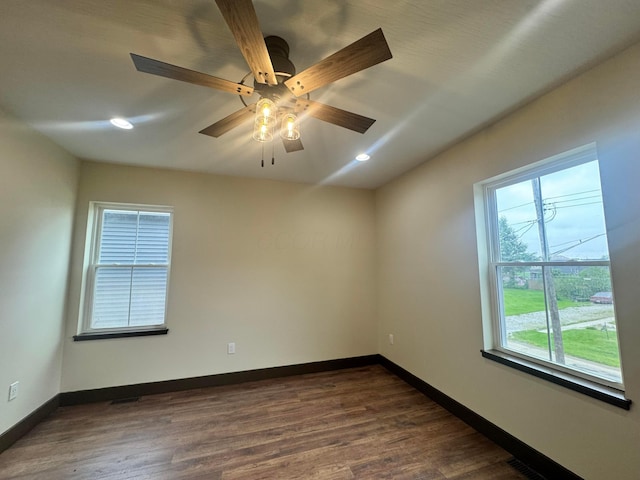 1624 Marlboro Ave, Obetz, OH 43207 - spare room with dark wood-style floors, a ceiling fan, and recessed lighting