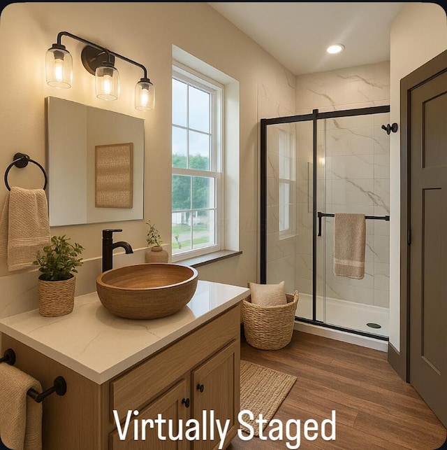 1624 Marlboro Ave, Obetz, OH 43207 - full bathroom featuring vanity, a stall shower, wood finished floors, and recessed lighting