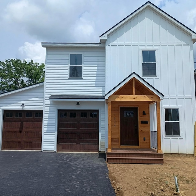 1624 Marlboro Ave, Obetz, OH 43207 - view of front facade with board and batten siding and driveway