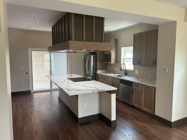 1624 Marlboro Ave, Obetz, OH 43207 - kitchen with stainless steel appliances, dark wood-style floors, backsplash, a center island, and recessed lighting