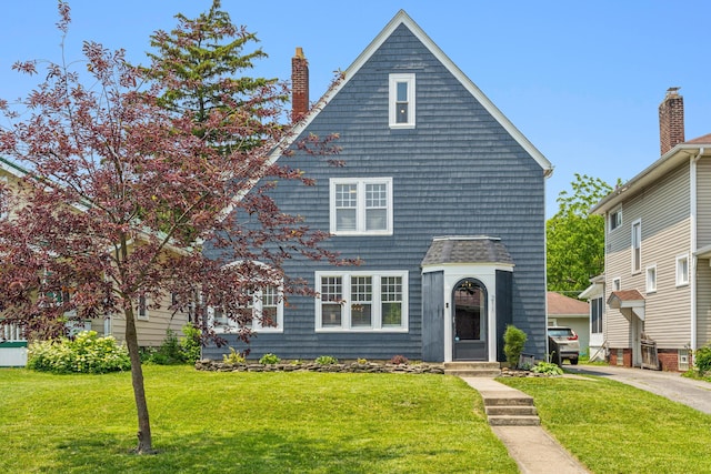 211 Guernsey Ave, Columbus, OH 43204 - view of front facade with a front yard and a chimney