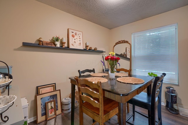 7581-7583 Pickett Ln Unit 83, Columbus, OH 43235 - dining space with wood finished floors and a textured ceiling
