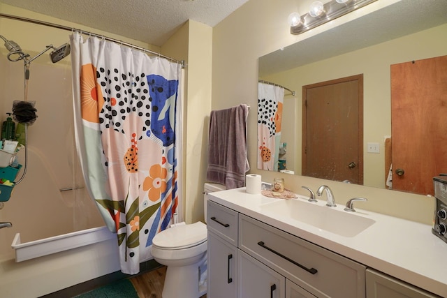 7581-7583 Pickett Ln Unit 83, Columbus, OH 43235 - bathroom with vanity, toilet, wood finished floors, a textured ceiling, and a shower with shower curtain