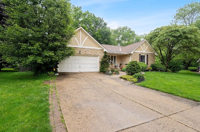 1027 Peggys Cv, Reynoldsburg, OH 43068 - view of front of house featuring an attached garage, a front lawn, driveway, and stucco siding