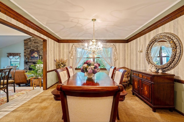 1027 Peggys Cv, Reynoldsburg, OH 43068 - dining area featuring a chandelier, wallpapered walls, crown molding, and light carpet