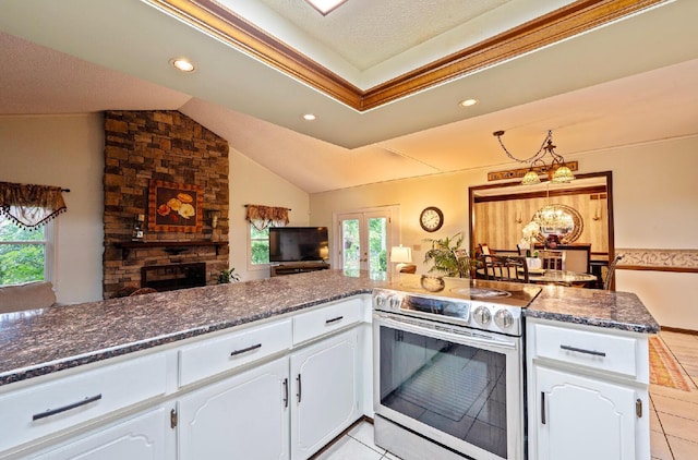 1027 Peggys Cv, Reynoldsburg, OH 43068 - kitchen featuring electric stove, white cabinets, light tile patterned floors, dark stone counters, and vaulted ceiling