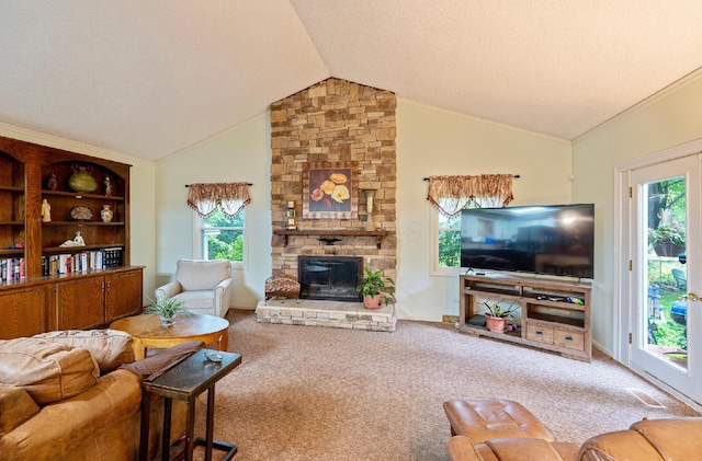 1027 Peggys Cv, Reynoldsburg, OH 43068 - carpeted living area featuring vaulted ceiling, healthy amount of natural light, a fireplace, and a textured ceiling